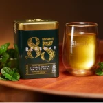 Herbata zielona z dodatkami ekspresowa w puszce - Dilmah 85 Reserve Ceylon Green Tea With Mint [20x2g]  - Cejlońska zielona herbata z dodatkiem liści mięty i olejku miętowego - 20 stożkowych biodegradowalnych torebek ekspresowych 2g z zawieszką w puszce 3